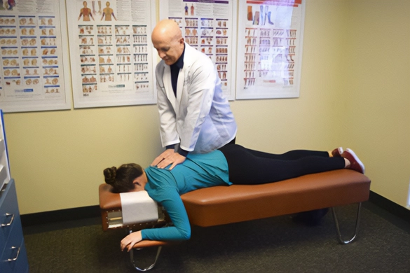 Chiropractor Crofton MD Nicholas Grande Adjusting Patient